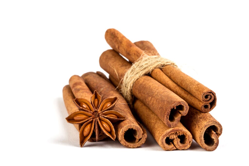 close-up-brown-cinnamon-stick-with-star-anise-spice-isolated-white